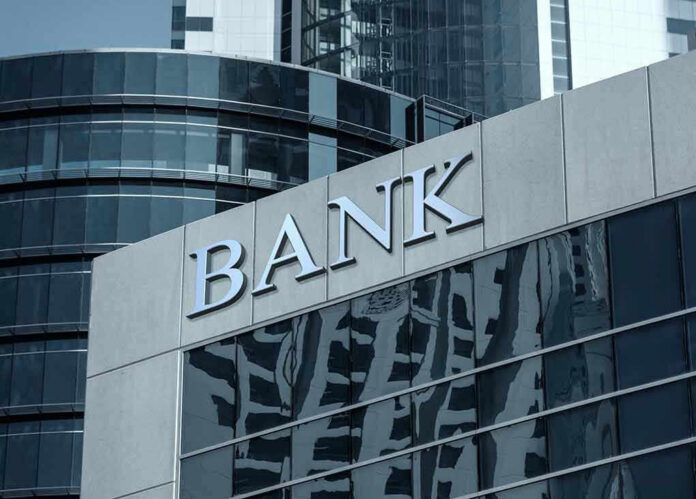 Bank building with glass facade and modern architecture.