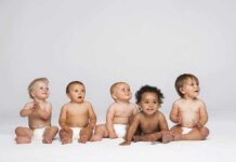 Global Depopulation Crisis Looms — IT’S REAL Five diverse babies sitting on a neutral background, displaying playful expressions