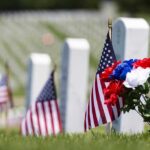 Incredible Operation: Old Guard’s Memorial Day Mission American flags and flowers placed at graves in a cemetery