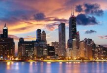 Illinois’ Tax Gamble: Are Bears the Winners? Chicago skyline at sunset with colorful clouds