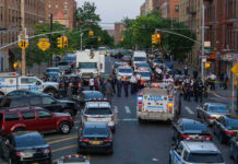 World Cup Panic: Gunman Hunted Police activity on a city street with emergency vehicles.
