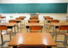 Predatory Teacher Exposed—New Rink Claims Erupt Empty classroom with desks and a chalkboard.