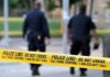 Bizarre Philly Raid—Chem Stockpile Stuns Feds Police officers walking past caution tape at a crime scene