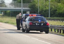 Shocking Dash: Dad Ditches Crying 4-Year-Old Police officer conducting a traffic stop on a highway