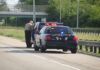 License Loopholes Exposed After Road Tragedy Police officer conducting a traffic stop on a highway