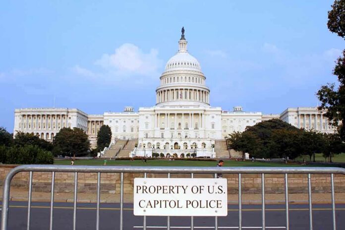 View of the U.S. Capitol building with a security barrier in front