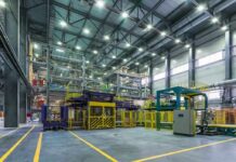 Factory Boom—or Inventory Mirage? Interior view of a modern industrial facility with manufacturing equipment