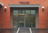 Weaponized CPS? Pete Buttigieg Case Sparks Alarm Entrance of a modern police station with brick facade