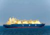 Hormuz Chaos Escalates — Massive US Strikes LNG tanker ship sailing on open sea.