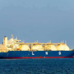 Hormuz Chaos Escalates — Massive US Strikes LNG tanker ship sailing on open sea.