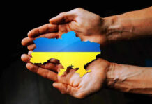 Zelenskyy’s Shock Purge Triggers Power Reboot Hands holding Ukraine map with flag design.