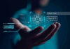 Four AIs, Four Agendas — Who Controls Truth? Hand holding digital AI and ChatGPT graphics.