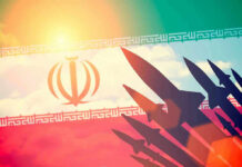 IRAN Hits Tankers — Trump Hammers Back Silhouettes of missiles over Irans flag graphic.