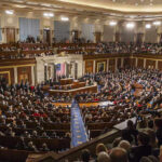 Bipartisan Earthquake: Housing Law Skips Trump Large assembly in a government legislative chamber.
