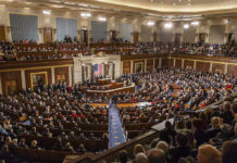 Bipartisan Earthquake: Housing Law Skips Trump Large assembly in a government legislative chamber.