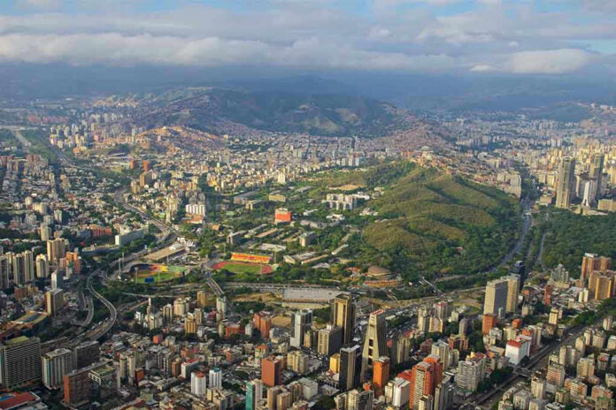 611942501 Aerial view of a city with hills and buildings.
