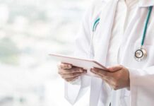 Shanghai Trial, Girl Dies—Silenced Doctor with stethoscope using a tablet