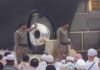 Staged Mourning? Iran’s Crowds Questioned Two security personnel near the Kaaba during a religious gathering