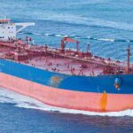 Hormuz Chaos: Tanker Hit, Trump Strikes Back Large cargo ship navigating through the ocean