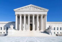 War Leaks Drag Media Into Crosshairs The Supreme Court building featuring marble columns and a clear blue sky