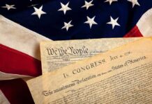 Patriotism Showdown: Fox Seizes Philly The Declaration of Independence laid on an American flag