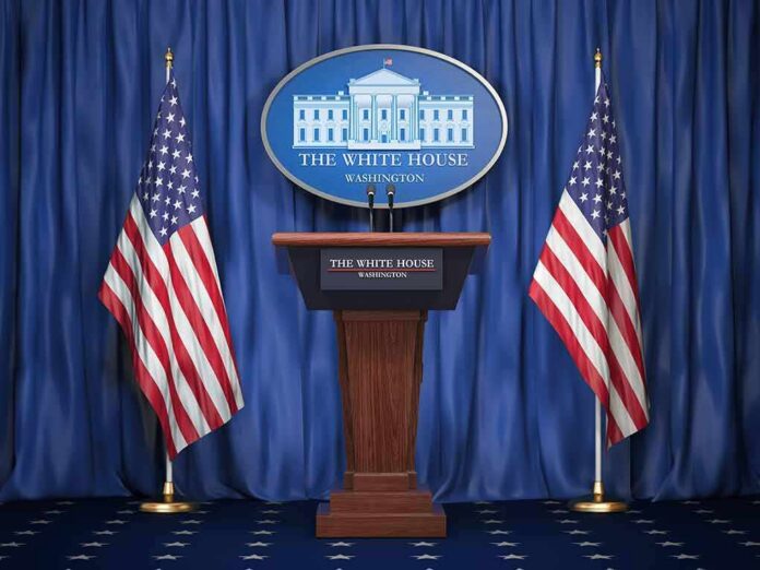 shutterstock_1159933525 White House press podium with microphones and two American flags