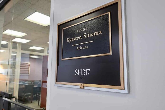 shutterstock_1402985657 Office door plaque with gold trim outside a glass-walled conference room