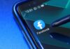 Facebook app icon on smartphone screen with stylus