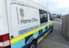 Immigration enforcement van parked on a street