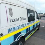 Immigration enforcement van parked on a street