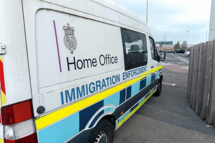 shutterstock_2212785583 Immigration enforcement van parked on a street
