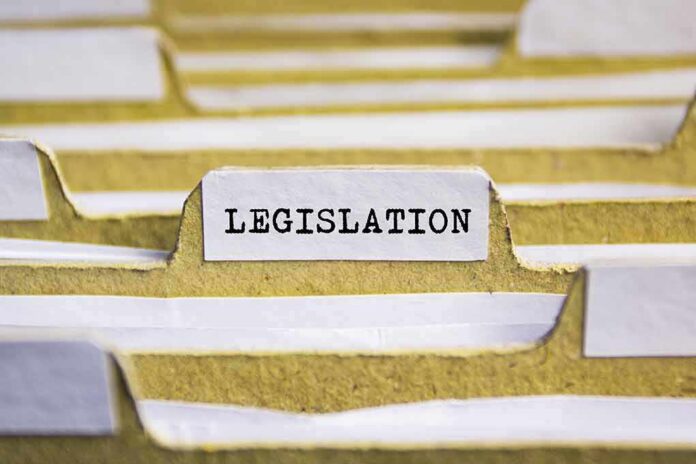 shutterstock_506543236 File folder tab labeled legislation
