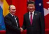 two men in suits shaking hands