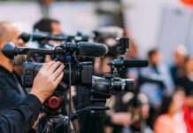Edibles Warp Driving For Hours Video cameras on tripods at a media event