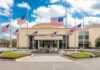 Legal Loophole Clears Path To Execution American flags at half-staff around a library entrance
