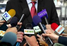 Press War Erupts: CNN Shut Out Press microphones surround a suited spokesperson