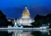 United States Capitol building at dusk with lights glowing