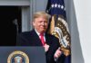 Border Bomb: Trump Sparks Unity Uproar Donald Trump clapping at a podium with the presidential seal