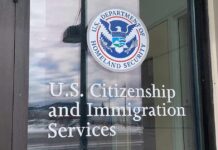 Deportation Bombshell: 10 Million Or Bust? Door with U.S. government seal and office lettering