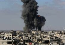 Missiles Over Riyadh, But What Exploded? Thick black smoke rises from an explosion over a dense urban area