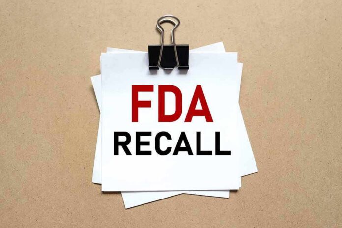 shutterstock_1995441497-1 Binder clip holding stacked papers labeled FDA recall