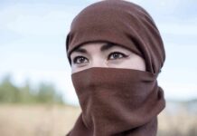 Spain City Revives Veil Fight Tatiana Akimova wearing a brown headscarf covering lower face outdoors
