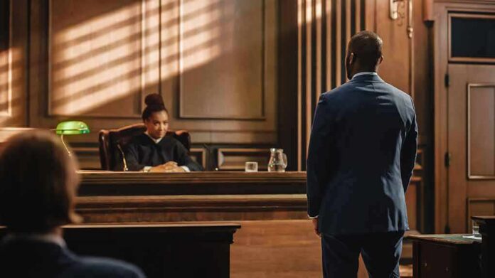 Judge presides as lawyer stands in courtroom
