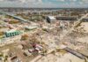 Aerial view of coastal town with widespread storm damage