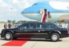 Unusual Tarmac Welcome Signals Tough Line Presidential limousine beside a large blue-and-white jet on a runway