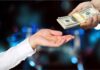 Taxpayer Outrage: Paid To Quit? Hands exchanging a stack of US dollar bills