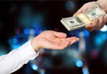Taxpayer Outrage: Paid To Quit? Hands exchanging a stack of US dollar bills