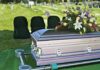 Tainted Pill Theory Rocks Hollywood casket with floral arrangement at outdoor graveside service