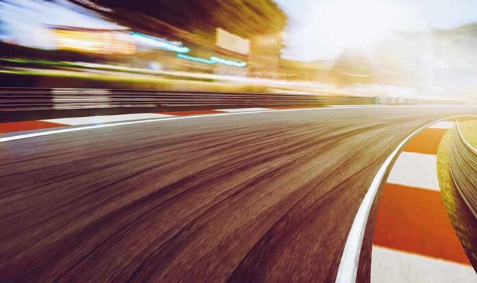 race track curve at sunset with motion blur