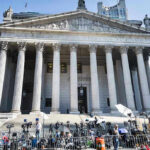 ‘Not To My Knowledge’ Ignites Firestorm Reporters and photographers gathered outside a neoclassical courthouse